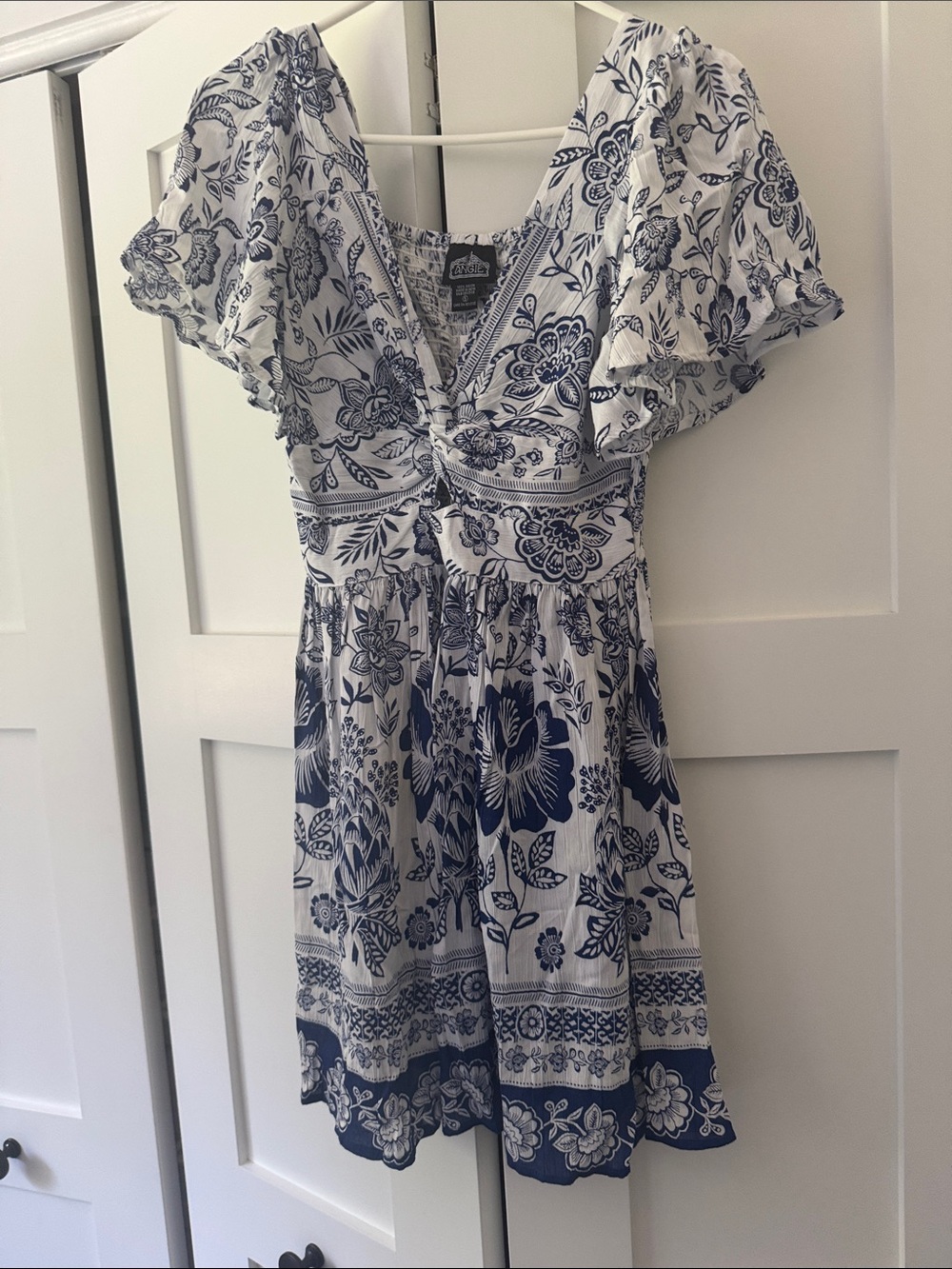 Angie Blue and White Floral Mini Dress with key hole in front.